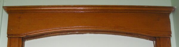 Elegant Arched Oak Header
