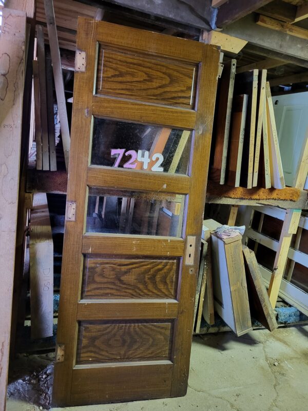 Interesting Paneled Door with Glass